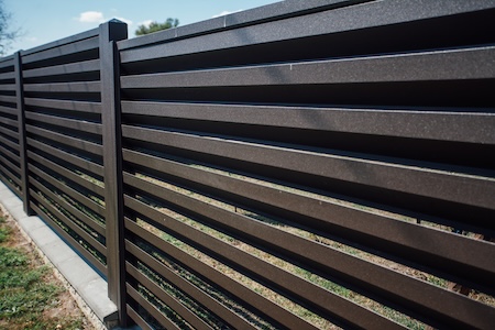 decorative fence with coastal landscaping in East Hill, Pensacola
