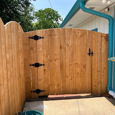 Scalloped-Top Wood Privacy Fence Installation 1